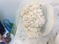 Vintage tiny white lilac floral wedding headpiece with small veil. Condition is very good. Well taken care of. Please note a few flower petals have darken you u could cut off or leave them as is. Velvet around front edge of headpiece has some discolor you could replace or try cleaning,or maybe even try fabric paint. This is totally up to the buyer. Again all in all this piece is fantastic. Measures 13 inches around front edge 6 inches deep. The band alone is 11 inches by 3 1/4 wide. Love vintage Vintage Cream Fascinator For Wedding, Vintage White Wedding Fascinator, Vintage Bridal Headpiece, Small Veil, Bridal Headpiece Vintage, Copper Measuring Cups, Floral Headpiece Wedding, 1940s Art Deco, 1940s Art