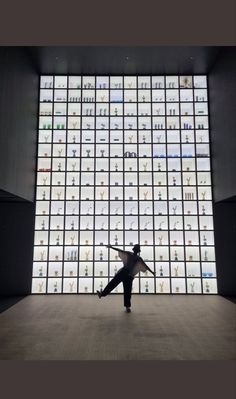 a person standing in front of a large display of jewelry