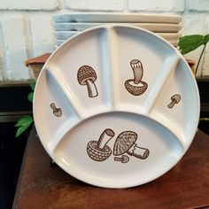 three white plates with different designs on them