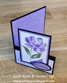 a close up of a card with a flower on the front and back side,