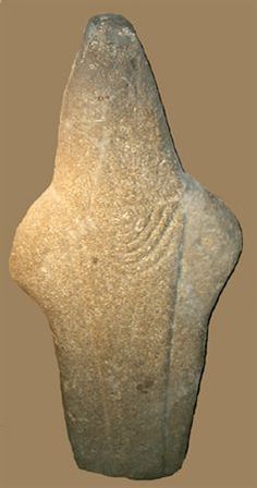 an old stone object is displayed on a brown background