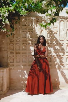 "The Red Shakti Dress"Our amazing Red flowing dress, adorned with bells around its entire diameter, truly embodies a musical and mystical persona. As you embark on your journey, a soft jingling sound follows your steps. This garment draws inspiration from Indian cultural traditions, especially the rituals performed during pilgrimages to holy lands. People in India believe that bells ward off evil spirits and generate high vibrations in our aura, which is why many religions and cultures incorpora Navratri Festival Maxi Length Dress, Navratri Festival Maxi Dress, Red Bohemian Dress For Navratri, Red Bohemian Dress For Festive Occasions, Festive Bohemian Red Dress, Red Maxi Dress For Navratri, Red Boho Dress For Festival, Red Sleeveless Dresses For Festivals, Red Sleeveless Dress For Festivals