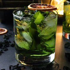 a close up of a drink in a glass on a table