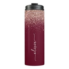 a red and pink water bottle with the word love written in white ink on it