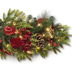 a christmas garland with pine cones, red and gold ornaments and lights on it's sides