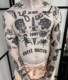 a man with lots of tattoos on his chest