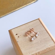 14KT rose gold round 1.50 carat lab-created diamond stud earrings. Make a fantastic gift! Perfect for everyday wear or starter diamond studs, Diamond color: G-H Diamond clarity: SI1/ SI2 5.75mm round lab created diamonds 14K Push Backs .75 Carat diamond per stud/ 1.50 total carat weight both studs 3 prong setting or otherwise known as the "Martini" setting Rose Gold Round Cut Diamond Earrings Gift, Rose Gold Round Cut Earrings For Gift, Rose Gold Earrings With Vvs Clarity As A Gift, Rose Gold Earrings With Vvs Clarity For Gift, Rose Gold Diamond Earrings As Gift, Rose Gold Brilliant Cut Diamond Earrings For Gift, Rose Gold Diamond Earrings With Vvs Clarity, Rose Gold Diamond Earrings With Vvs Clarity As Gift, Hypoallergenic Rose Gold Round Diamond Earrings