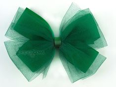 "Emerald green tulle hair bow perfect for your ballerina and special occasions! 5 inch size, pinwheel style. Bottom bow made with grosgrain ribbon, top layer made with tulle. Smooth, grosgrain center. CLIP OPTIONS: Clip #1: For baby / toddlers / little girls / fine hair 1.75\" long, partially lined alligator clip with non slip grip. Clip #2: For big girls / thick or curly hair 3\" long, partially lined clip with teeth, knot wrapped around clip, and non slip grip. Thank you for choosing Poppybows Emerald Green Christmas, Fancy Hair Bows, Tulle Hair Bow, Ballerina Hair, Tulle Hair Bows, Ribbon Top, Green Tulle, Christmas Hair Bows, Ballerina Girl