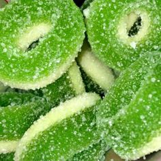 green sugar coated donuts sitting on top of each other