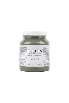 a jar of grey soap sitting on top of a white surface with the word futon written