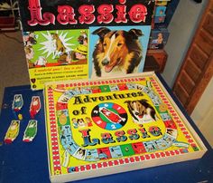 an assortment of games and puzzles on a blue table