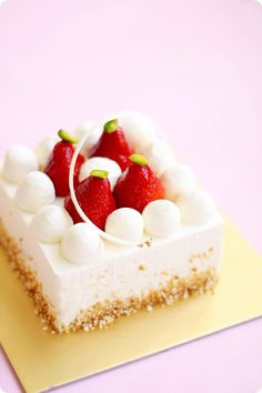 a piece of cake with strawberries and marshmallows on top