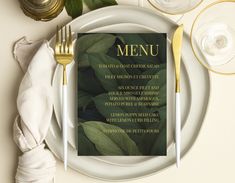 a plate with a menu on it next to silverware and gold utensils