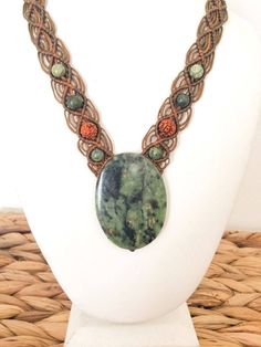 Large green South african Jade macrame necklace Dark green South African Jade (Buddstone Jade)  cabochon, large size, with black and yellow veins, set in brown macrame necklace, decorated with natural Rudraksha seeds (From Nepal) and green serpentine stone beads.  Beautiful earthy colors combination, spiritual and presence full necklace.  The necklace is made of waxed cotton strings, which are highly resistant to water, sweat, stains and heat.. this necklace can practically stay with you forever Brown Macrame, Macrame Necklaces, Purple Candles, Serpentine Stone, Necklace Big, Protection Amulet, Large Stone, Jade Necklace, Macrame Necklace