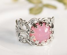 Vintage Pink Opal RingPink Glass by hangingbyathread1 on Etsy Bohemian Pink Wedding Rings, Handmade Vintage Pink Rings, Adjustable Pink Opal Ring As A Gift, Victorian Opal Cabochon Ring As Gift, Victorian Hallmarked Opal Ring, Pink Opal Sterling Silver Ring Gift, Vintage Pink Cabochon Ring, Victorian Multi-stone Opal Ring, Victorian Multi-stone Opal Ring As Gift