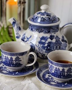 blue and white porcelain tea set on a table