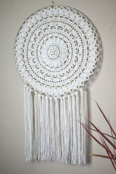 a white doily hanging on the wall