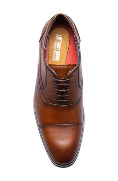 A squared cap toe and polished leather lend modern sophistication to a sleek oxford set on a well-cushioned footbed for optimal support. Removable, cushioned insole with arch support Leather upper/textile lining/rubber sole Imported Cognac Cap Toe Oxfords For Business, Formal Brown Oxfords With Removable Insole, Brown Cushioned Oxfords For Semi-formal Occasions, Brown Oxfords With Cushioned Footbed For Semi-formal Occasions, Brown Semi-formal Oxfords With Cushioned Footbed, Semi-formal Brown Oxfords With Cushioned Footbed, Elegant Oxfords With Cushioned Footbed, Brown Business Oxfords With Removable Insole, Business Brown Oxfords With Removable Insole