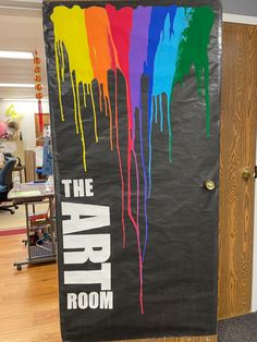 the art room door is decorated with rainbow paint