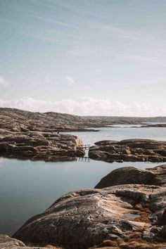 a body of water surrounded by large rocks