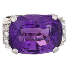 Stylish vintage amethyst & diamond cocktail ring crafted in 14 karat white gold. Oval faceted amethyst measures 18mm x 13.5mm. Six diamonds total an estimated 0.12 carats (estimated at H-I color and SI1-I1 clarity). The amethyst is in very good condition and free of cracks or chips. The east to west setting highlights the beautiful rich royal purple amethyst making this ring a standout! The medium rise ring (10mm - 0.39 inches) sits comfortably on the finger. The ring is in very good condition a Luxury Platinum Amethyst Ring With Brilliant Cut, Formal Amethyst Diamond Ring With Diamond Accents, Formal Amethyst Rings With Diamond Accents, Luxury Platinum Amethyst Ring With Center Stone, White Gold Amethyst Diamond Ring With Brilliant Cut, White Gold Brilliant Cut Amethyst Diamond Ring, White Gold Diamond Ring With Brilliant Cut Amethyst, Formal Amethyst Ring With Diamond Accents In White Gold, Brilliant Cut Amethyst Ring In Platinum For Anniversary