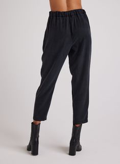 The Nico Clean Waist Slouchy Trouser is the perfect blend of style and comfort. With its clean waist and slouchy fit, this trouser is both fashionable and comfortable to wear. Expertly designed for a chic and relaxed look, these trousers are a must-have for any wardrobe. 100% TENCEL™ Lyocell. SIZE WAIST INSEAM FRONT RISE XS 27 1/2" 27 3/4" 12 1/2" S 29 1/2" 27 3/4" 13" M 31 1/2" 27 3/4" 13 1/2" L 33 1/2" 27 3/4" 14" Relaxed Fit High-waisted Viscose Pants, High-waisted Relaxed Fit Viscose Pants, Chic High-waisted Pants For Elevated Casual Occasions, Chic Elevated Casual High-waisted Pants, Relaxed Workwear Bottoms For Fall, Relaxed Fit Viscose Pants For Fall, Relaxed Fall Workwear Bottoms, Relaxed Ankle-length Work Pants, High Waist Viscose Pants For Work