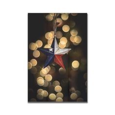 a texas flag ornament hanging from a string