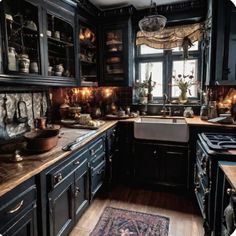 a large kitchen with black cabinets and wooden flooring is decorated in antique style decor