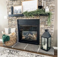 a living room with a fire place and pictures on the wall above it's mantle