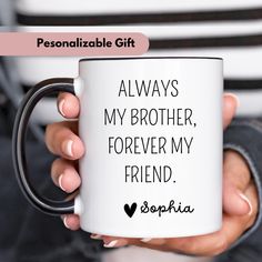 a person holding a coffee mug that says, always my brother, forever my friend