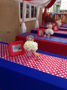 red, white and blue table cloths with pictures on them