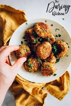 a person is holding a plate with some food on it and the title reads, the daring kitchen