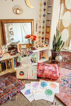 a living room filled with lots of colorful rugs and decor on top of a carpet