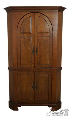 a wooden cabinet with two doors on the front and one door open to reveal an arched doorway