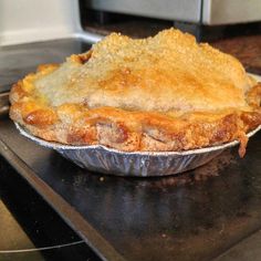 a pie sitting on top of a metal pan