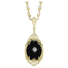 Very Rare to find these necklaces in yellow gold! Most were made in white and platinum. The yellow gold and black onyx combined with the masterful Art Deco Workmanship is truly something special! Enjoy! --Stone(s):-- (1) Natural Genuine Black Onyx - Oval Cut - Prong Set - Rich Black Color - 24x18mm (approx.) (1) Natural Genuine Diamond - Old Mine Cut - Prong Set - 0.22ct (approx.) Total Carat Weight: 0.22 (approx.) Material: Solid 14k Yellow Gold Weight: 8.8 Grams Chain Type: Fancy Link Chain Ch Oval Fine Jewelry Necklace With Intricate Design, Art Deco Pendant Necklace For Formal Occasions, Elegant Gemstone Necklace For Collectors, Collectible Yellow Gold Necklaces With Intricate Design, Evening 14k Gold Jewelry With Black Enamel, Elegant Necklaces With Intricate Design For Collectors, Elegant Collectible Necklaces With Intricate Design, Elegant Intricate Collectible Necklaces, Elegant Intricate Design Necklaces For Collectors