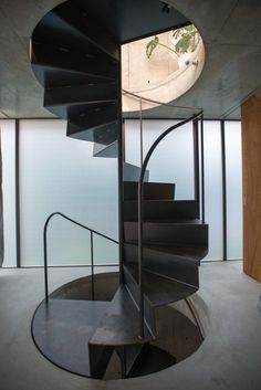 a spiral staircase in the middle of a building