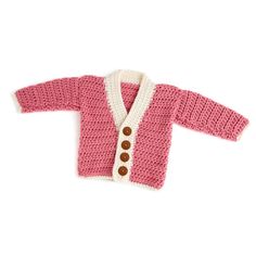 a pink and white knitted cardigan with buttons on the front, sitting against a white background