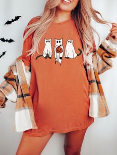 The perfect shirt for any cat lover who is looking for a special Halloween Tee to wear this year. This funny cat tee is a great gift for any Halloween Babe and is sure to be loved by any lady who loves cats! ✨ You get: Extra coziness A relaxed fit Eye-catching designs ✨ Details: Comfort Colors Brand Shirt  Unisex Adult Sizing. 100% ring-spun cotton Soft-washed, Garment-dyed fabric Screen-printed directly onto the garment, no vinyl or heat transfer. ✨ Size: Our shirts are unisex sizing. Please see images for measurements and recommendations for oversized looks. ✨ Care Instructions: Machine wash: cold (30C or 90F), inside-out, gentle cycle with mild detergent and similar colors.  Do not bleach. Tumble dry: low heat. Iron, steam, or dry: low heat, inside-out if necessary.  Do not iron decorat Tshirts For Women, Fall Apparel, Halloween Party Gifts, Oversized T Shirt Dress, Ghost Shirt, Halloween Fall, Halloween Tees, Trendy Shirts, Branded Shirts