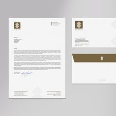 a letterhead, envelope and business card are displayed on a gray background with brown accents