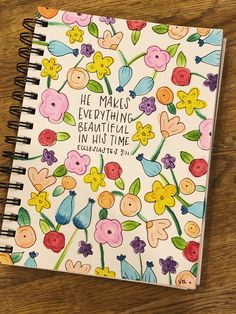 a spiral notebook with flowers and the words he makes everything beautiful in his time written on it