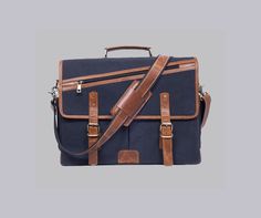 a blue and brown briefcase with leather straps