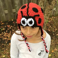 Ladybug Crochet Hat - Cuteness Overload Is A Delightful Accessory for Your Little One Looking for something adorable? You're at the right spot. Our Ladybug Crochet Hat is what you need. It guarantees to elevate your child's cuteness quotient. Not only will your little bug feel cozy, but they'll also draw compliments wherever they go. Handcrafted with Love We weave each hat with love and passion. High-quality yarn ensures softness and durability. Thus, your child experiences optimum comfort. In a Cute Red Handmade Crochet Hat, Adjustable Red Crochet Hat, Ladybird Hat, Crochet Ear Flap Hat, Ladybug Crochet Hat, Crochet Animal Hat, Ladybug Hat, Ladybug Crochet, Red Handmade Crochet Hat, One Size