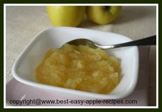 a spoon in a small white bowl filled with food