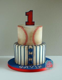 a baseball themed birthday cake with the number one on it's top and bottom tier