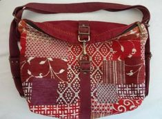 LaeSevilla bags Boho tapestry convertible backpack rucksack shoulder bag.   Measures approximately 11.5"H X 14"L X 4"W with 6" strap drop and adjustable backpack straps.  Red, purple, burgundy and orange tapestry with faux suede.  Features a top zippered closure and clasp, inside fully lined in gray fabric with a zippered pocket , slip pocket and pen slot.  Antique brass tone hardware.  Handmade in Spain.   This is a pre-owned new, unused item in excellent condition, see photos for full details/ Handmade Tapestry Shoulder Bag For Travel, Handmade Red Backpack, Handmade Red Hobo Bag For Travel, Vintage Red Backpack Bag, Tapestry Shoulder Bag With Removable Pouch For Travel, Travel Shoulder Bag With Removable Pouch In Tapestry, Rectangular Tapestry Shoulder Bag For Travel, Daily Use Tapestry Bags With Adjustable Strap, Multicolor Tapestry Bags For Everyday Use