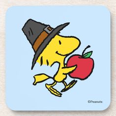 a cartoon character holding an apple in one hand and wearing a hat on the other