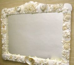 a mirror with shells and seashells on it