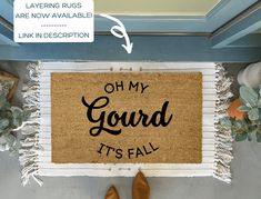 a door mat with the words oh my gourd it's fall on it