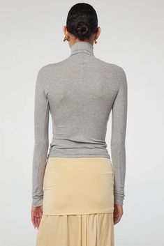 Shop our Blixa Ribbed Turtleneck - slim-fit top made of lightweight micro-modal rib. Perfect with skirts or denim. 90% Micro Modal, 10% Spandex. Line By K, High Hips, Slim Fit Top, Womens Turtleneck, Turtleneck Top, Ribbed Turtleneck, Running Stitch, Turtle Neck Top, Heathers